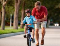 Teaching a child to ride a two-wheeled bicycle